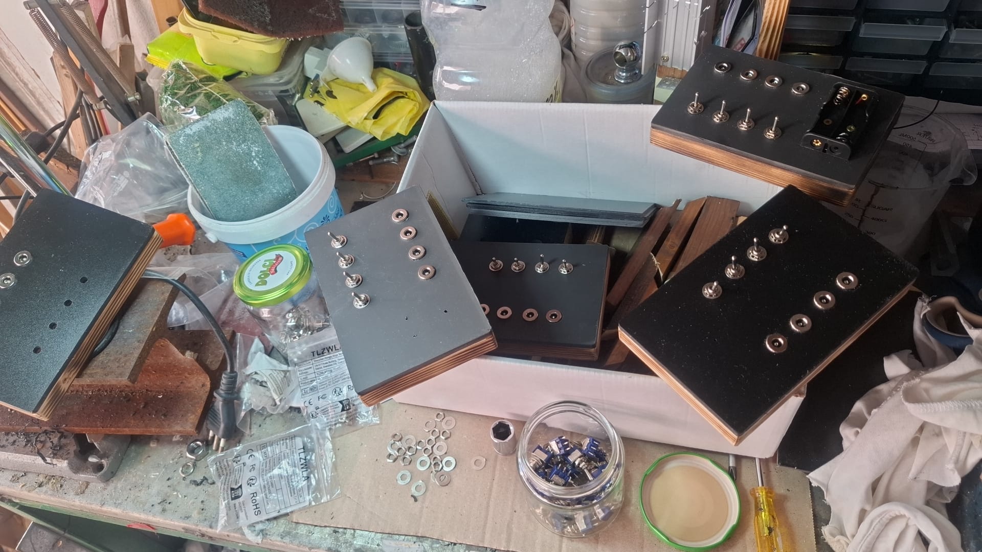 Our workshop bench with several Turing Box tops being assembled
