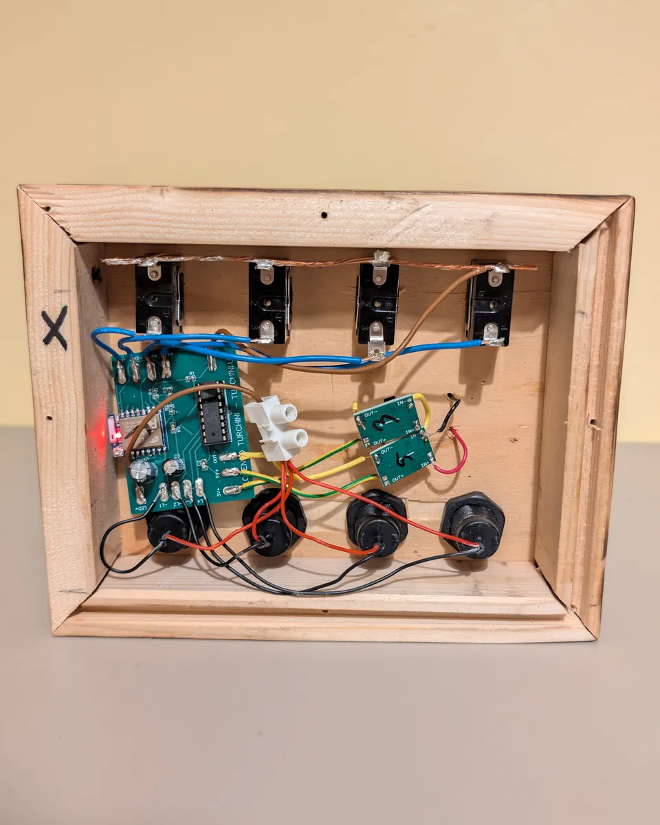 Inside the Edison Edition: custom circuit board, voltage regulator modules, toggle switches and USB sockets wired by hand